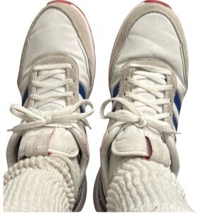 Adidas Woman’s White and Blue Striped Sneakers.Ladies size 9.5 Men size 8 unisex